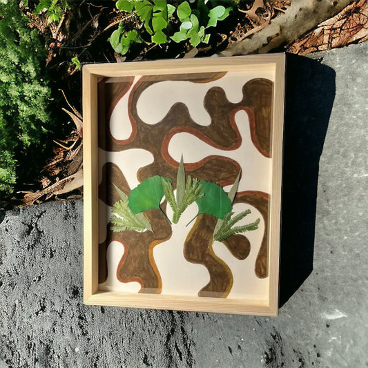 Brown abstract flower art laying by plants